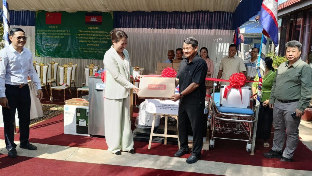 Health worker using donated laptop to improve rural healthcare in Cambodia